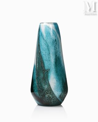 a picture of a vase with a blue and green design on it