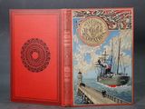 un livre rouge sur lequel figure l'image d'un bateau