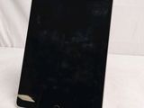 a close up of a tablet computer sitting on top of a table