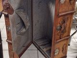 an open suitcase sitting on a tiled floor in a room