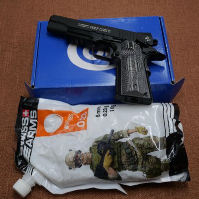 a gun that is sitting on top of a package