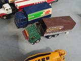 a lot of toy trucks that are on the table