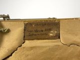a piece of wood that has a piece of writing on it