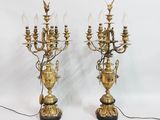 pair of antique brass candelabs with glass lamps