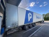 a semi truck that is parked in a parking lot