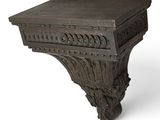 an image of a wooden shelf with carvings on it on a white background