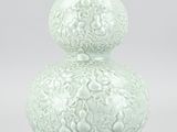 a white vase with a decorative design on it