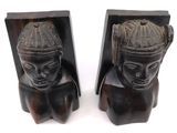 these are two bookends with a woman ' s head and a man ' s head on them