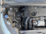 the engine of a car with its hood open and the hood down