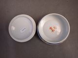 two bowls sitting on a table with a price tag on them