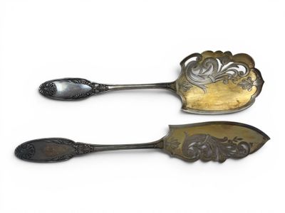pair of antique silverware spoons on white background with white background