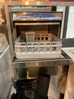 an open refrigerator with a bunch of dishes inside of it