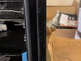 a black oven with a door open in a room