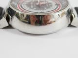 a close up of a watch on a white surface