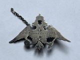 an image of a silver necklace with an eagle on it