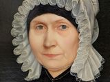 portrait of a woman in a bonnet with a book in her hand