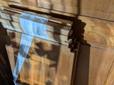 a picture of a wooden door with a blue tape on it