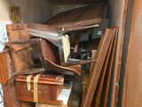 many pieces of luggage stacked on top of each other in a room