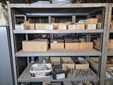 many boxes of tools on a shelf in a warehouse