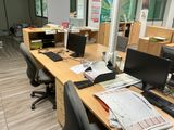 a desk with two computer monitors and a keyboard on it