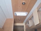 a view of a kitchen with a stove, microwave, and cabinets