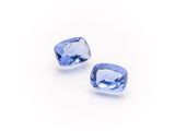 a pair of tanzanite gems on a white background