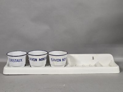 three cups sitting on a tray with a tray underneath them