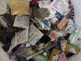 a white trash can filled with assorted items
