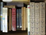 a box full of books that are sitting on top of each other