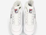 white sneakers with a logo on the side of the shoe