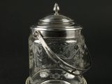 un bocal en verre ancien plaqué argent, surmonté d'une cuillère