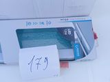 a white box with a note on it sitting on a table