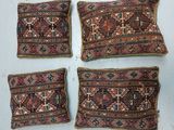 quatre coussins en tapis persans anciens