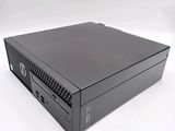 an image of a black desktop computer sitting on top of a white surface