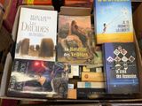many books that are in a box on the table