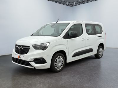 the white van is parked in a large room