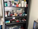 a medicine cabinet in the corner of the room