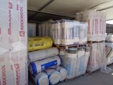 many rolls of toilet paper and rolls of toilet paper in the back of a truck