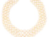 a three strand pearl necklace with a gold clasp