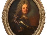 portrait of a man in armor with a sword in a gold frame