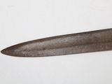 a knife that is laying on a white surface
