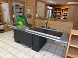 a kitchen with a sink and a counter in it