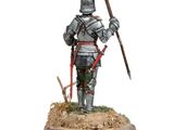 the figurine is standing on a wooden base with a sword