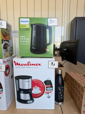many boxes of coffee machines on the table