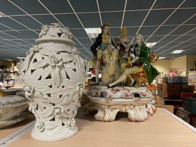 two vases sitting on a table in a store