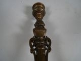 brass plated candle holder with ornate design on a white background