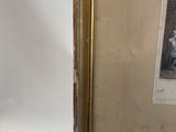 a framed photograph of a man in a suit and tie holding a cane