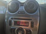 a car dashboard with a digital clock in the center
