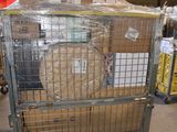 a large metal cage with a bunch of boxes in it