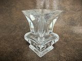 a glass vase that is sitting on a table
